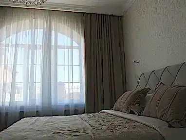 Шторы в интерьере спальни